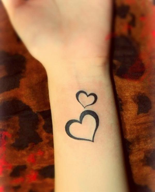 Mažos širdies simbolių tatuiruotė