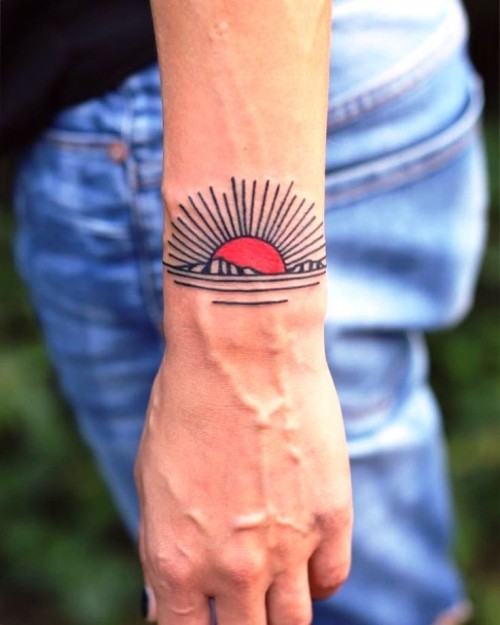 Håndleddet tatovering ideer rød soloppgang