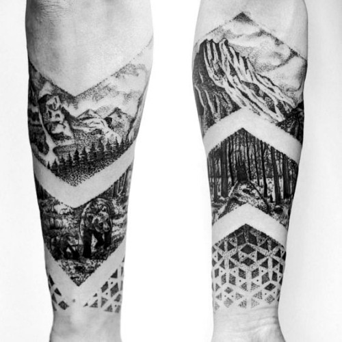 Negativní vesmírné tetování s motivy zdi a horské krajiny