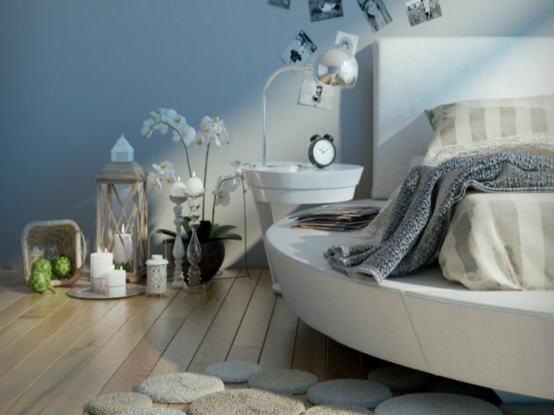 ložnice s kulatou postelí v bílé barvě