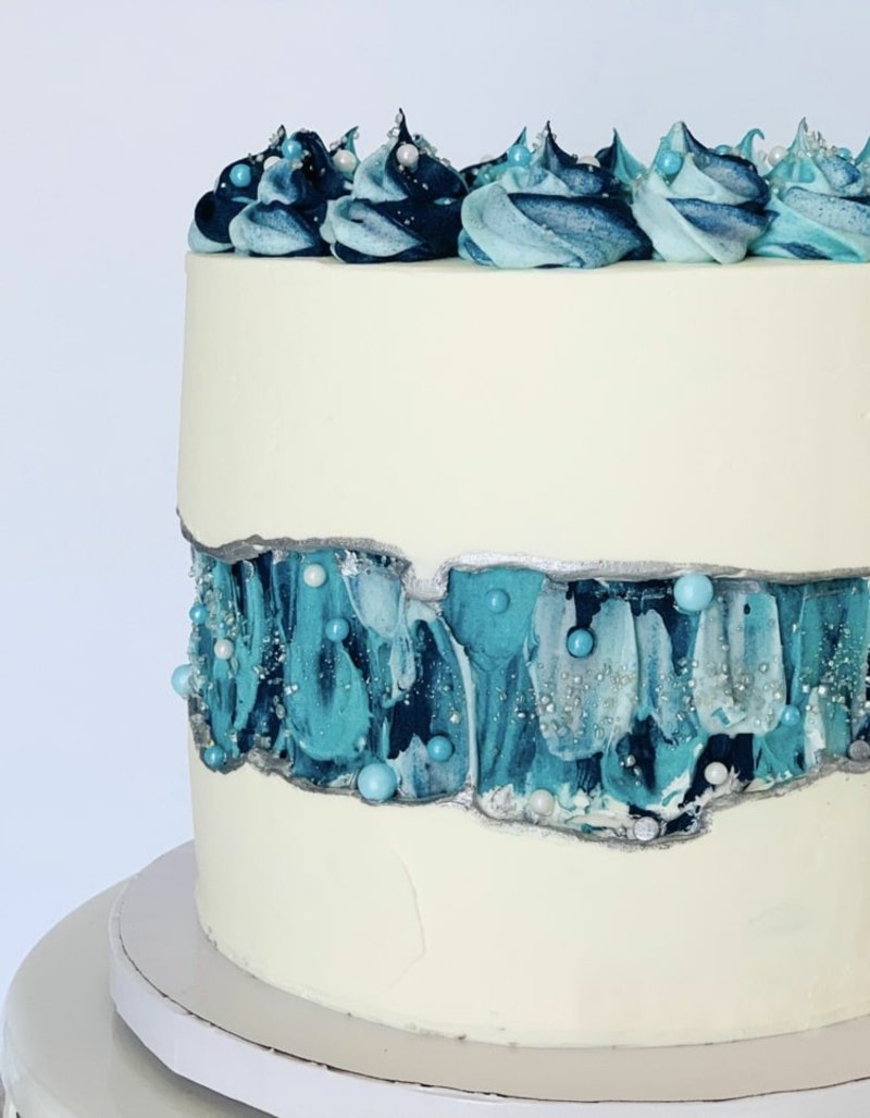 Kake i hvitt og blått lite kunstverk